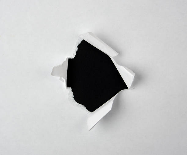 istock round torn hole with twisted edges in white paper 1152204237