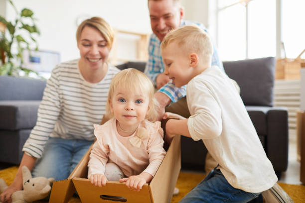 istock Playful family having fun in new flat 1152205798