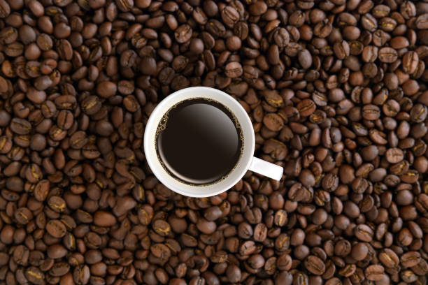 istock Top view white coffee mug or cup in coffee beans. 1152206099