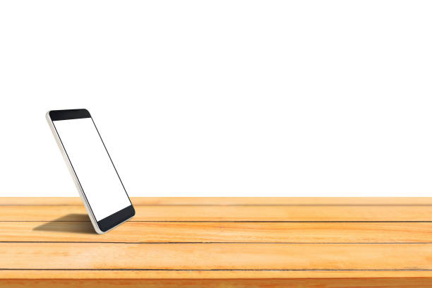 istock Close up smartphone with blank white screen put on wooden table isolated on white background. 1152206388