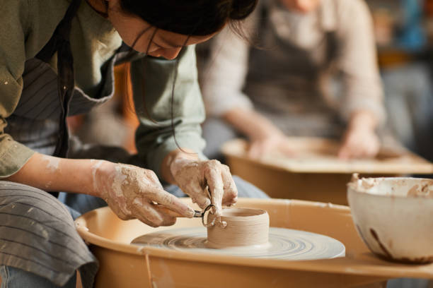 istock Shaping wet clay on pottery wheel 1152207991