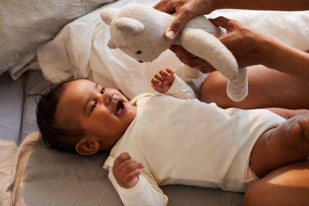 istock Excited baby looking at toy 1152209627