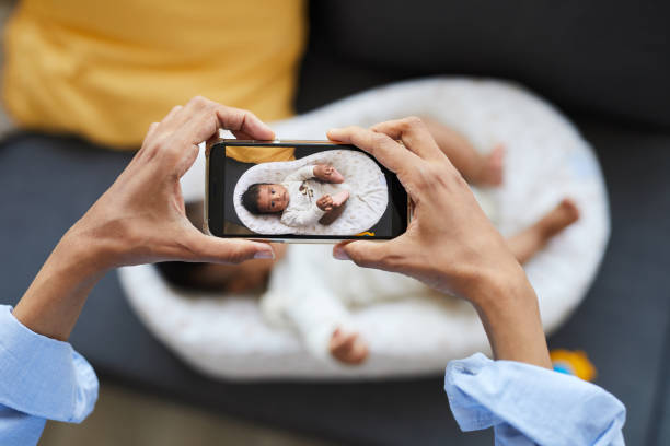 istock Photographing baby in cocoon 1152209668