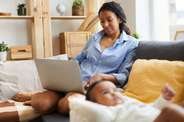 istock Young African mother working at home 1152209692