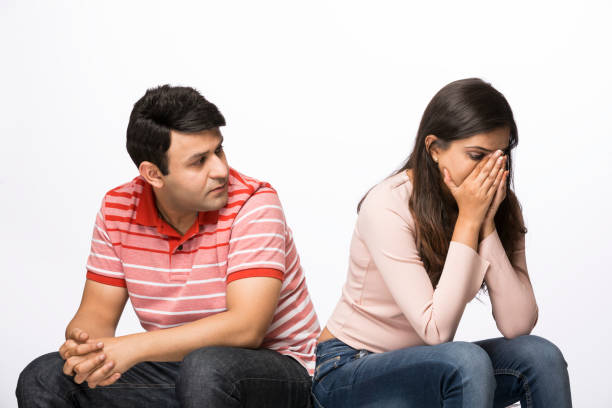 Couple with their backs turned to each other - Stock image Breaking, Back, Living Room, Domestic Room, Human Back divorce INDIA stock pictures, royalty-free photos & images