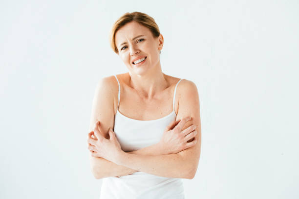 istock sick woman scratching skin while looking at camera isolated on white 1152216013
