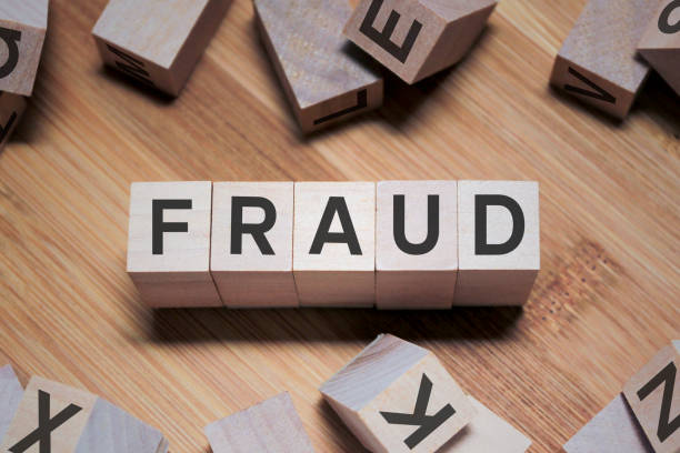 istock Fraud Word In Wooden Cube 1152217599
