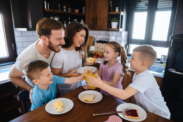 istock Family with three children having breakfast at home 1152219055