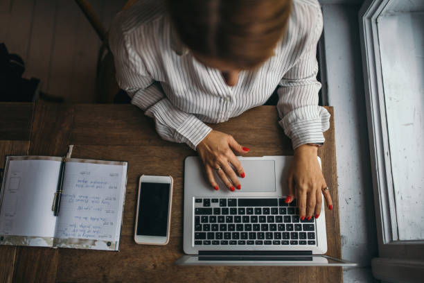 istock Attractive woman working on a laptop computer 1152222328