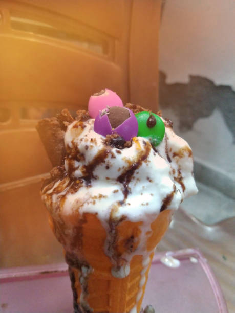 istock Vanilla ice-cream cone with gems, chocolate chip 1152222447