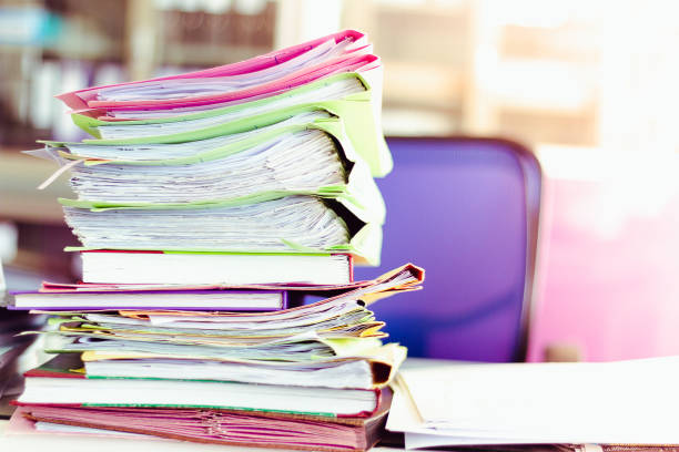 istock Stack of documents placed on a business desk in a business office. 1152222635