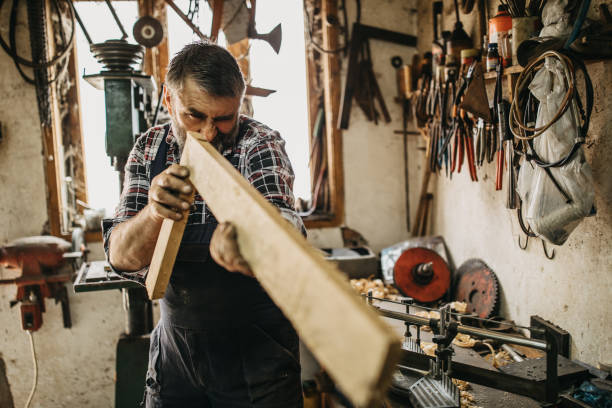istock Senior man working on cutting wood 1152224725