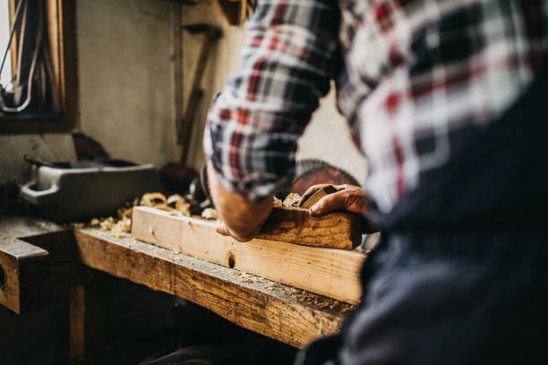 istock Senior man working on cutting wood 1152224986