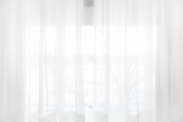 istock Defocused curtain window and stationery box with sunlight. 1152226115
