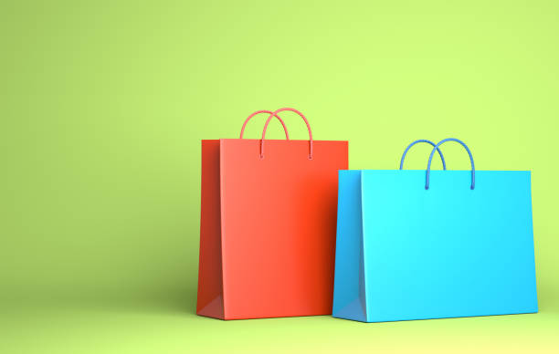 istock Two Empty Shopping Bags on the green 1152227004