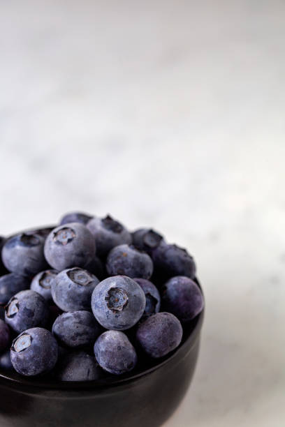 Blueberry's on marble stock photo