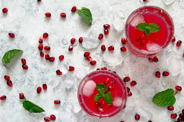 istock Ripe pomegranate with juice on light background. 1152227723