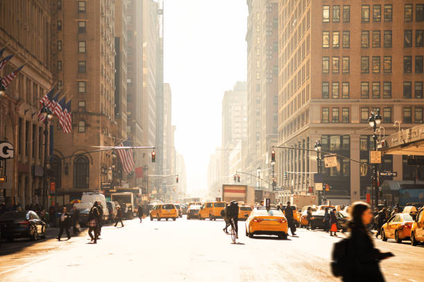 manhattan motion blurred rush hour - crossing people panoramic road imagens e fotografias de stock