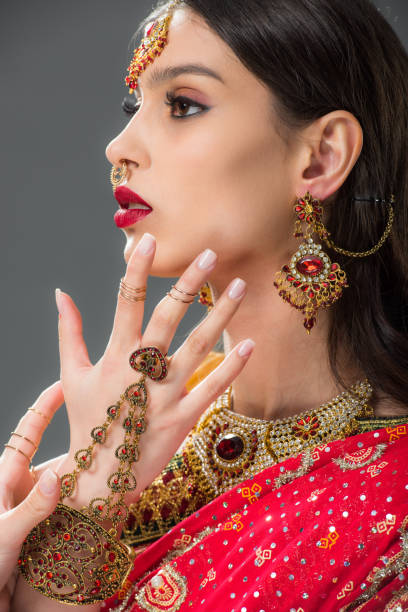 istock beautiful indian woman gesturing in accessories, isolated on grey 1152228107