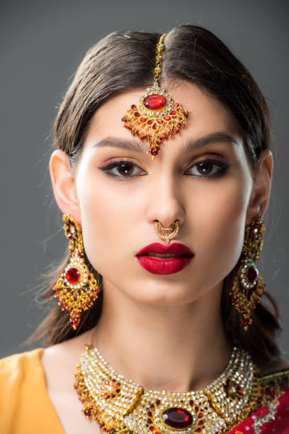 istock attractive indian woman in traditional bindi, isolated on grey 1152228151