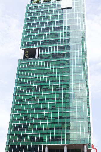 Glassy facaade of modern skyscraper in Singapore near Marina Bay