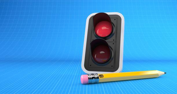 istock Red traffic light with pencil on blueprint background 1152229393