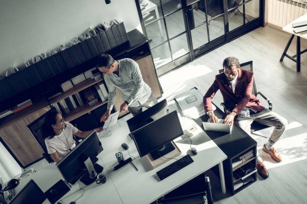 istock Three successful businessmen working on project together 1152229725