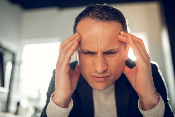 istock Businessman suffering from headache and high pressure 1152229772