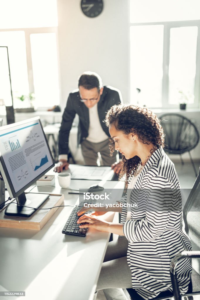 Mail Secretary Curly Secretary Wearing Striped Jacket Typing Email On Computer Stock ...