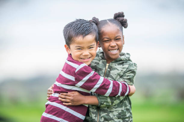 istock Portrait of friends hugging 1152229865