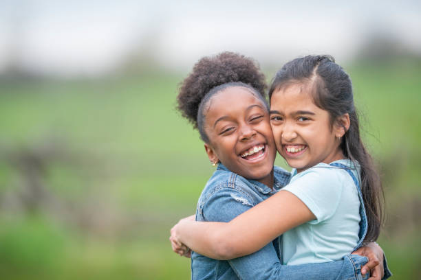 istock Portrait of friends hugging 1152229888