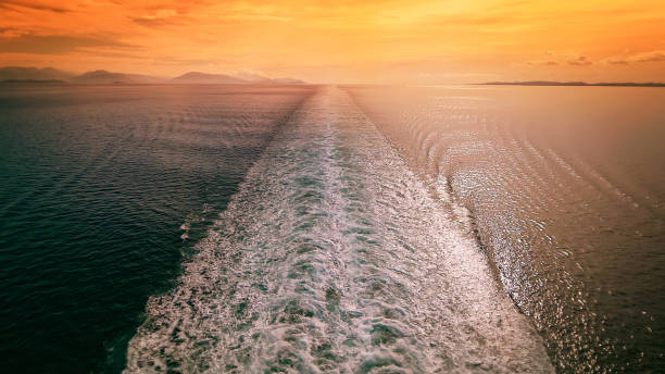 Cruise Ship Wake in Mediterranean Sea at Sunset - Travel Vacation Cruise ship wake in the Mediterranean sea at sunset, travel vacation sea wake stock pictures, royalty-free photos & images