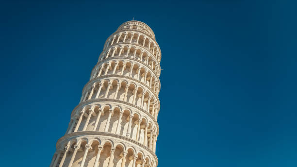 Tourists Visit Leaning Tower of Pisa in Italy Tourists sightseeing at the Leaning Tower of Pisa in Italy pisa stock pictures, royalty-free photos & images
