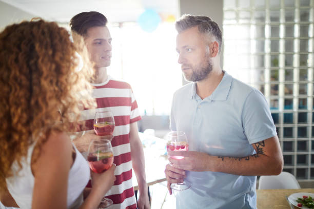 istock Guests Chatting at Party 1152231092