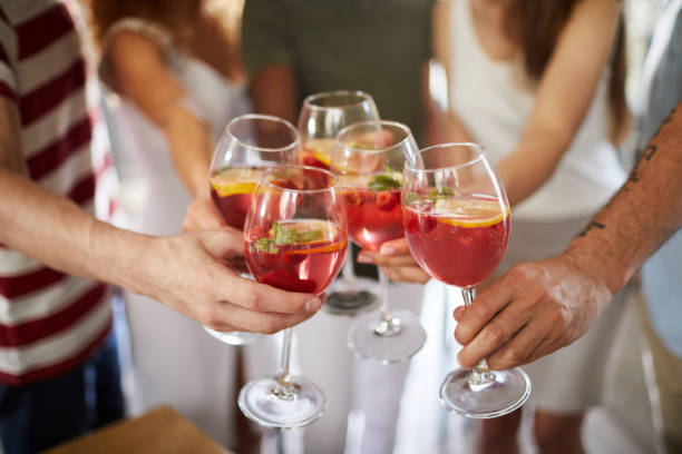 istock Friends Clinking Glasses Closeup 1152231119