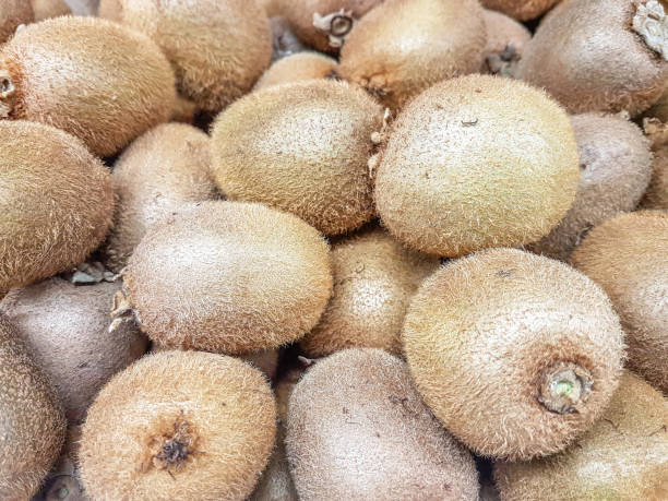 istock Fresh kiwi fruit in boxes on display at market 1152231269