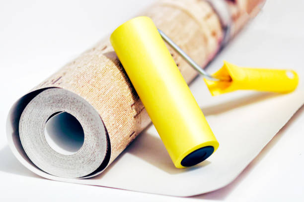 istock Composition tools for home repair and interior renovation indoors. Rolls of wallpaper, roller. 1152233603