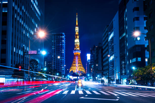 Tokyo Tower spotlit dusk overlooking zooming traffic city streets Japan Asia, East Asia, Japan, Tokyo - Japan, Tokyo Sky Tree sumida ward photos stock pictures, royalty-free photos & images