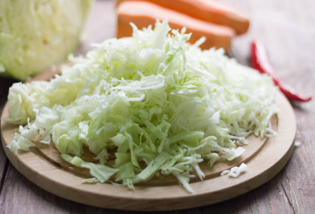 istock sliced white cabbage fresh on the kitchen table, healthy food concept 1152234088