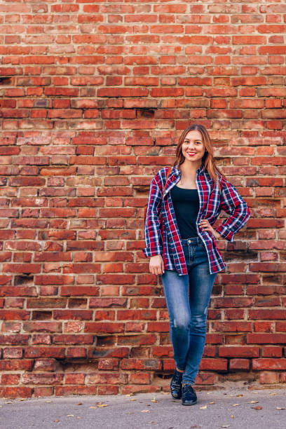 Free Stock Photo of Woman Standing in Front of Brick Wall | Download ...