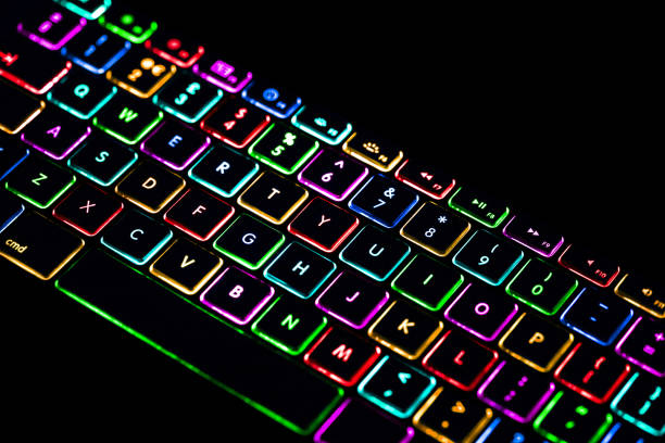 istock Laptop / notebook / PC computer colourful light keyboard isolated on black background. Cut out 1152238530