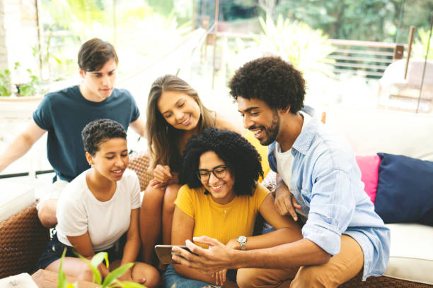 istock Good friends spending time together and having fun, looing at cell phone. 1152239850