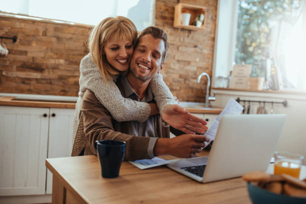 The monthly finances Cropped shot of an affectionate young couple working on a budget Petrovaradin stock pictures, royalty-free photos & images