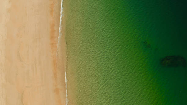 istock Ocean with waves and yellow beach 1152242929