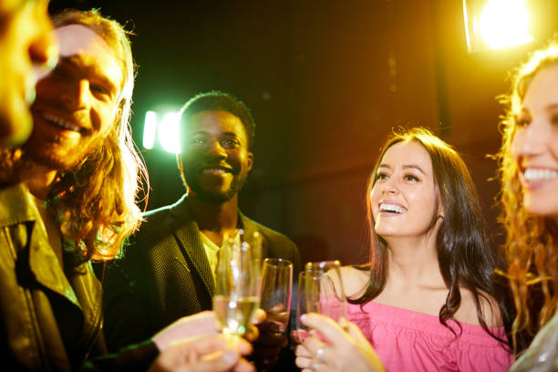 istock Positive friends talking in nightclub 1152245982
