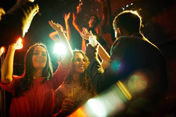 istock Beautiful girls dancing at party 1152245988