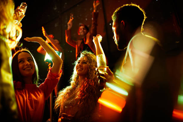istock Pretty ladies dancing and flirting with men 1152245998