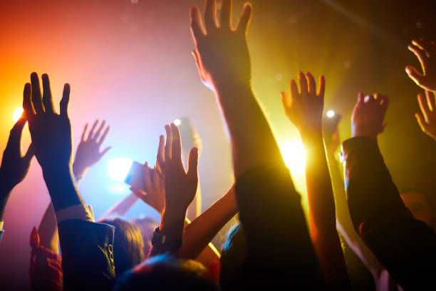 istock Waving hands in air during performance of musician 1152246034