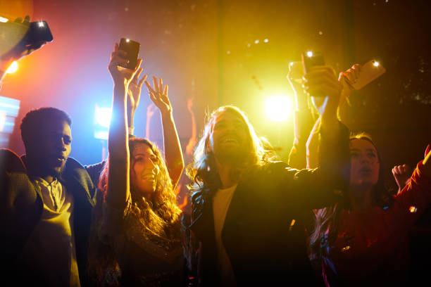 istock Jolly people screaming at musical concert 1152246064