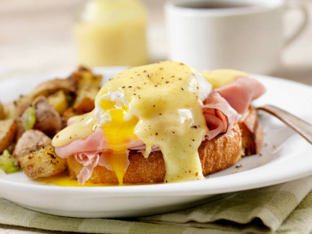 istock Eggs Benedict with Black Forest Ham and Hash Browns on Grilled French Bread 1152247465